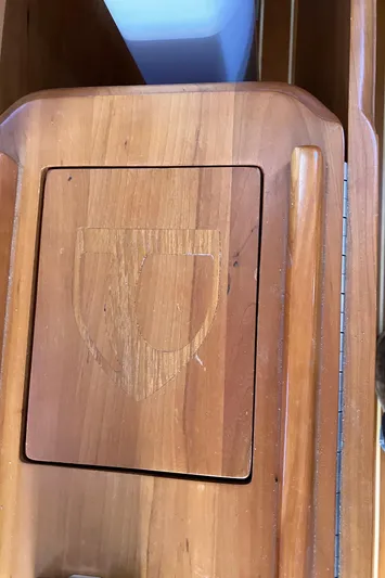 Celebration Yacht Photos Pics Wooden panel with engraved shield emblem on a 2007 Tartan 3400 boat.