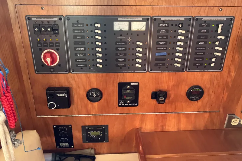 Celebration Yacht Photos Pics Control panel of a 2007 Tartan 3400 yacht with various switches and gauges.
