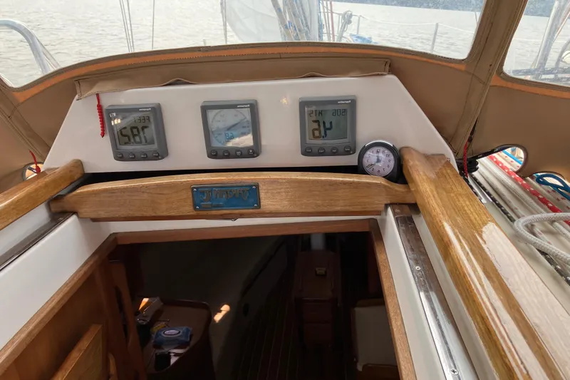 Celebration Yacht Photos Pics 2007 Tartan 3400 yacht cockpit with navigation instruments and wooden finish.