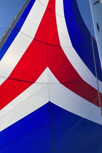 Celebration Yacht Photos Pics Colorful sail of a 2007 Tartan 3400 yacht with red, white, and blue patterns.