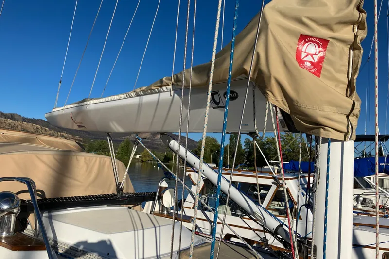 Celebration Yacht Photos Pics Sailboat Tartan 3400, 2007 model, with beige sail cover and rigging, docked under clear sky.