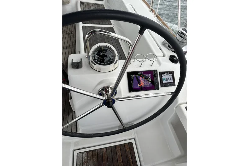  Yacht Photos Pics Steering wheel and navigation instruments on 2017 Beneteau Oceanis 45 sailboat.