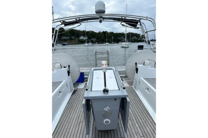  Yacht Photos Pics Beneteau Oceanis 45 sailboat deck, 2017 model, docked in a serene marina.