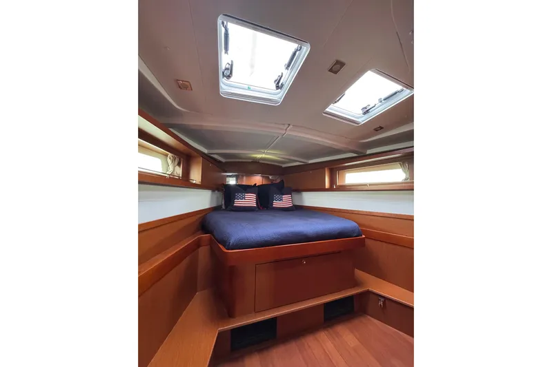  Yacht Photos Pics Interior cabin of 2017 Beneteau Oceanis 45 yacht with skylights and cozy bedding.