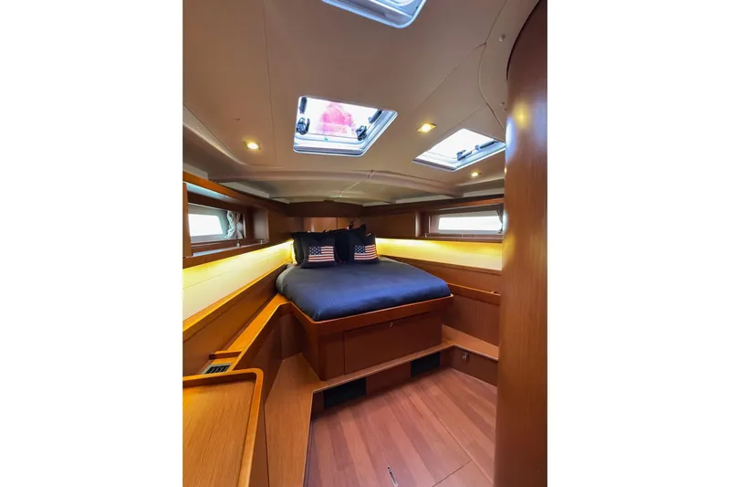  Yacht Photos Pics Luxurious cabin interior of 2017 Beneteau Oceanis 45 yacht with skylights and cozy bedding.