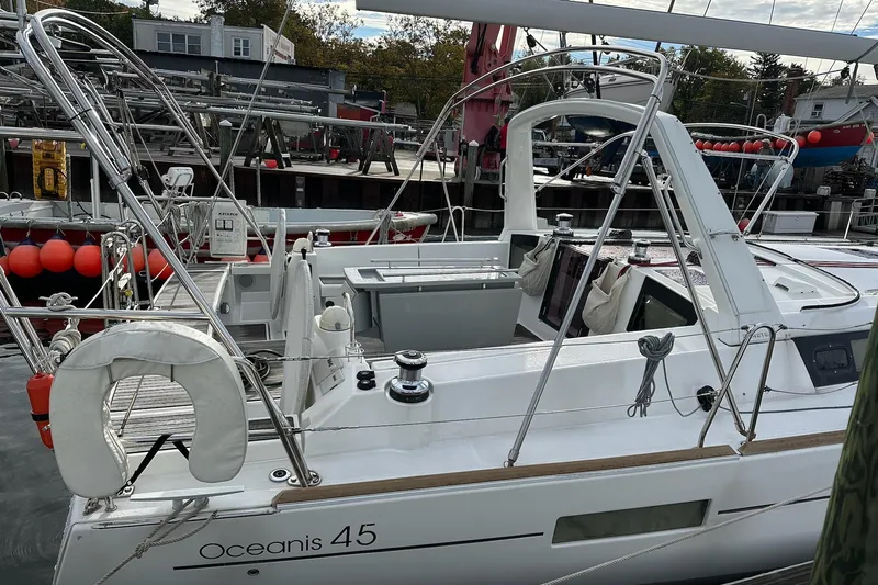  Yacht Photos Pics 2017 Beneteau Oceanis 45 sailboat docked, showcasing sleek design and modern features.