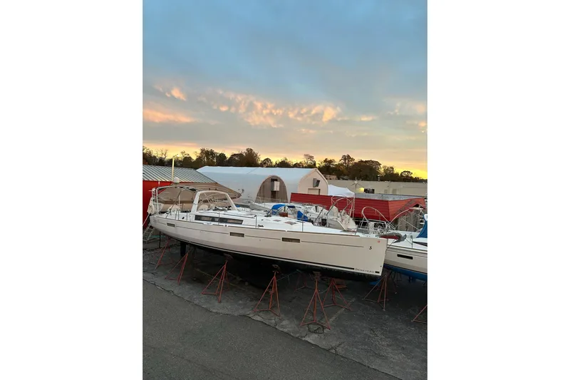  Yacht Photos Pics 2017 Beneteau Oceanis 45 sailboat on stands at sunset, in a boatyard setting.
