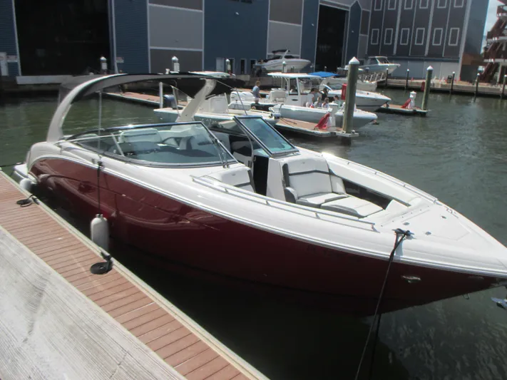  Yacht Photos Pics 2017 Regal 3200 Bowrider docked at marina, sleek design, red and white exterior.