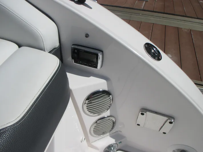  Yacht Photos Pics Interior of 2017 Regal 3200 Bowrider with speakers and control panel.
