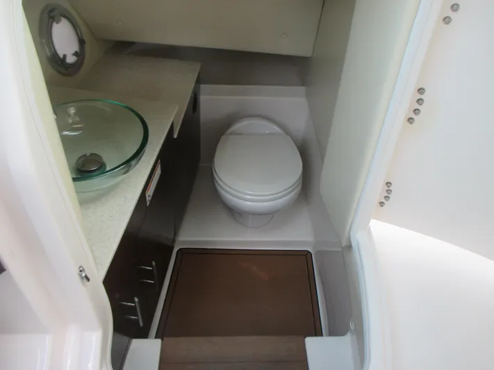  Yacht Photos Pics 2017 Regal 3200 Bowrider bathroom with modern sink and toilet.