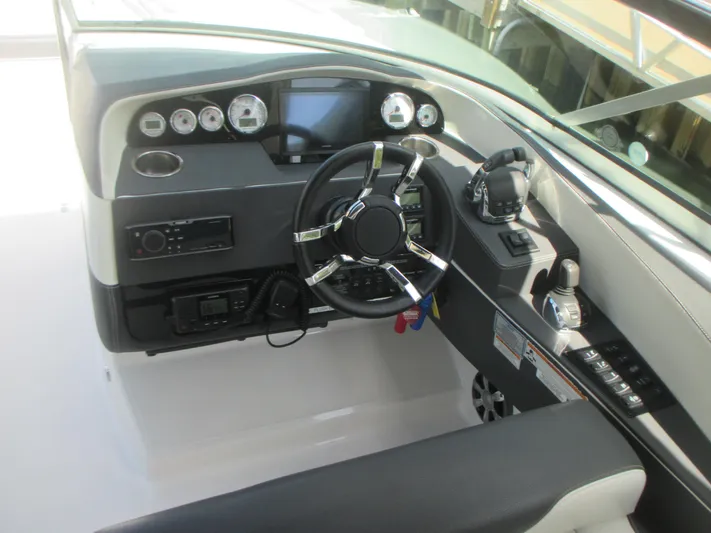  Yacht Photos Pics 2017 Regal 3200 Bowrider dashboard with steering wheel and control panel.