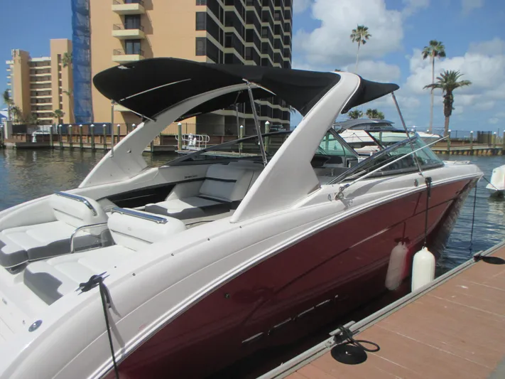  Yacht Photos Pics 2017 Regal 3200 Bowrider docked, featuring sleek design and spacious seating.