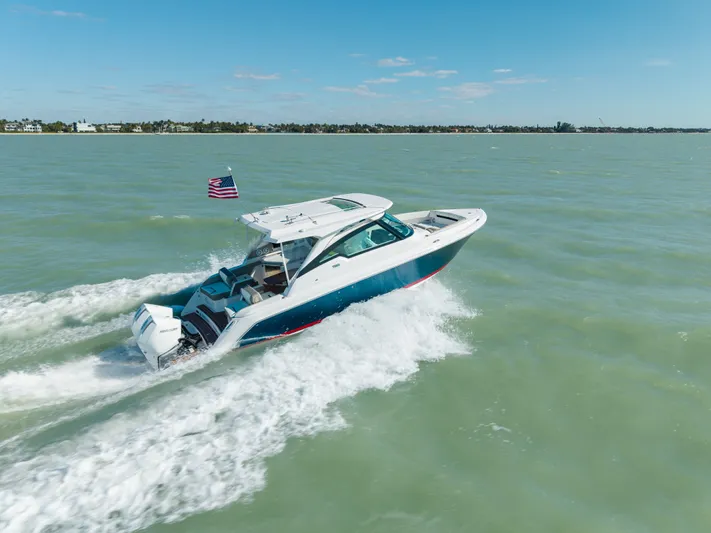  Yacht Photos Pics 2023 Tiara Yachts 34 LX cruising on open water.