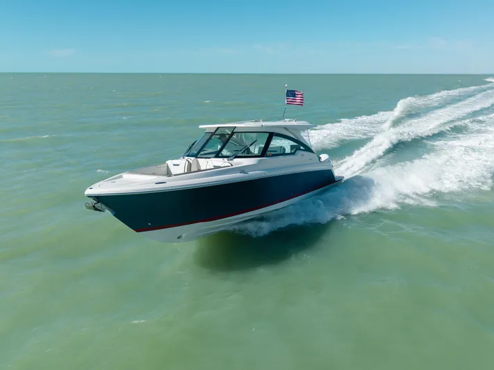  Yacht Photos Pics 2023 Tiara Yachts 34 LX cruising on open water.