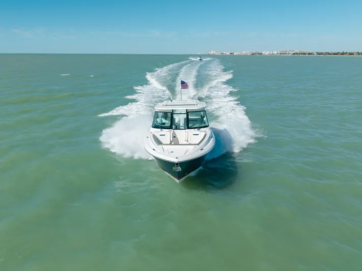  Yacht Photos Pics 2023 Tiara Yachts 34 LX cruising on open sea.