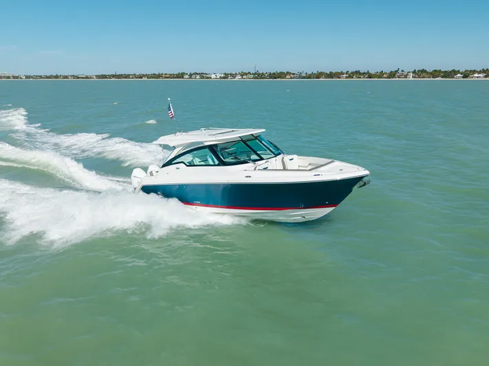  Yacht Photos Pics 2023 Tiara Yachts 34 LX cruising on open water.