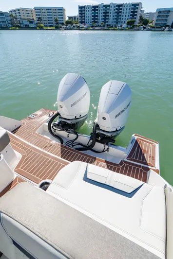  Yacht Photos Pics 2023 Tiara Yachts 34 LX with Mercury engines on calm water.