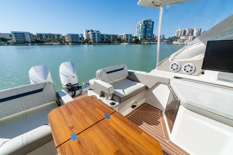  Yacht Photos Pics 2023 Tiara Yachts 34 LX on calm waters with modern amenities.