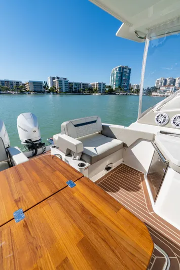  Yacht Photos Pics 2023 Tiara Yachts 34 LX with wooden table and water view.