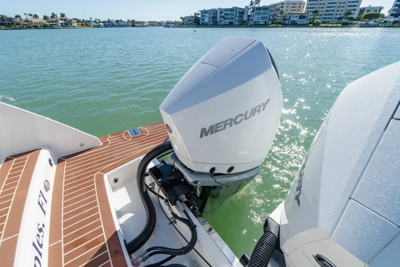  Yacht Photos Pics 2023 Tiara Yachts 34 LX with Mercury engines on calm water.