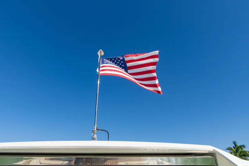  Yacht Photos Pics US flag flying on Tiara Yachts 34 LX, 2023 model.