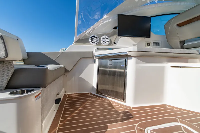  Yacht Photos Pics Interior of 2023 Tiara Yachts 34 LX with seating and refrigerator.