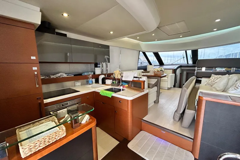  Yacht Photos Pics Luxurious interior of 2014 Prestige 550 Fly yacht with modern kitchen and seating area.