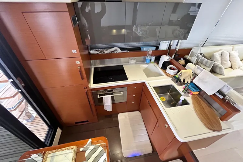  Yacht Photos Pics Luxurious kitchen interior of 2014 Prestige 550 Fly yacht with modern amenities.
