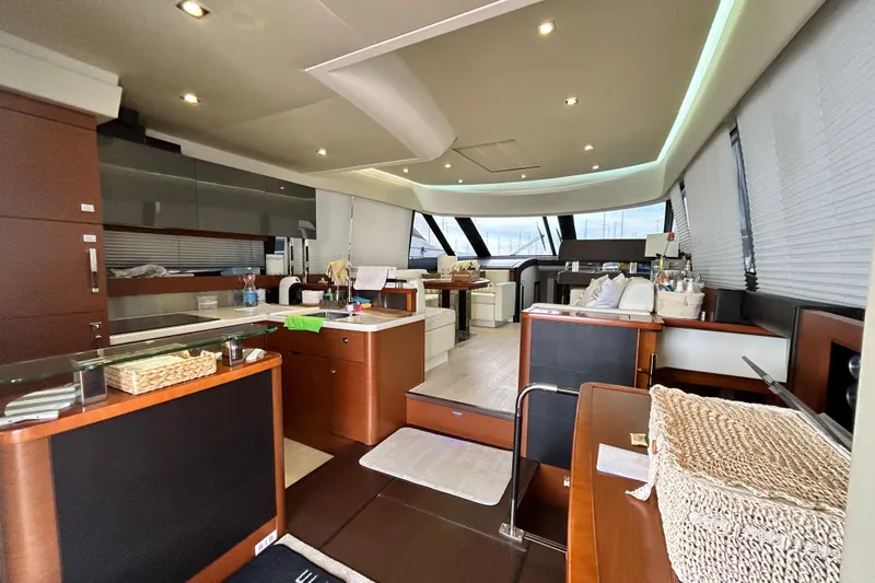  Yacht Photos Pics Luxurious interior of 2014 Prestige 550 Fly yacht with modern kitchen and seating area.