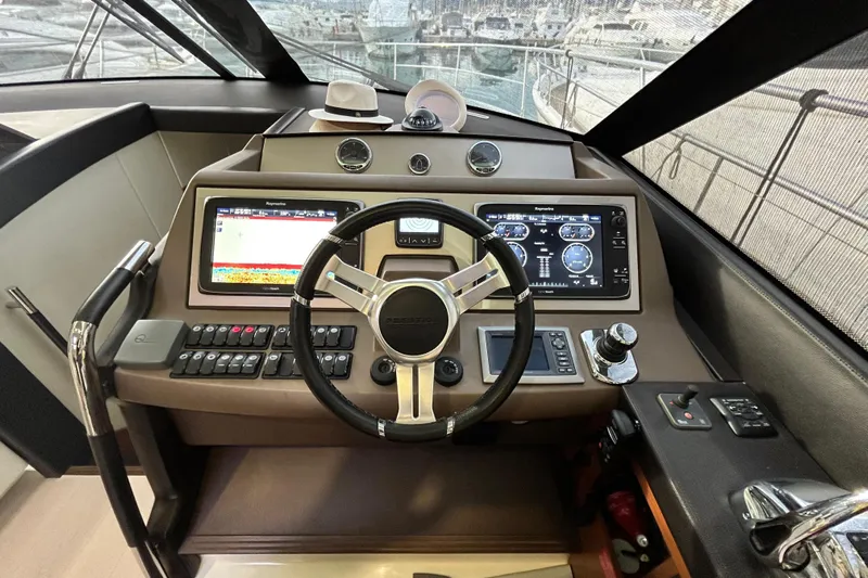  Yacht Photos Pics Cockpit of 2014 Prestige 550 Fly yacht with advanced navigation controls and displays.