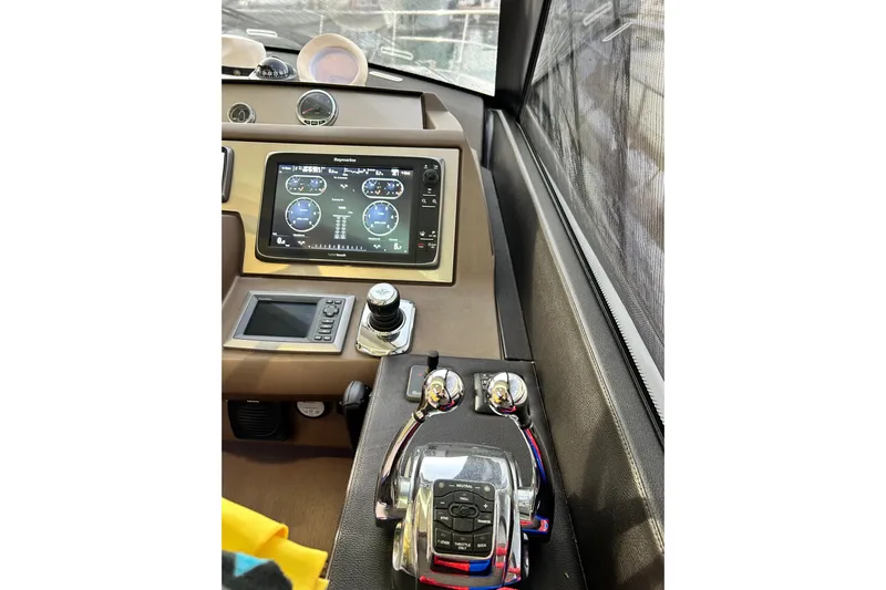  Yacht Photos Pics Control panel of 2014 Prestige 550 Fly yacht with navigation display and controls.