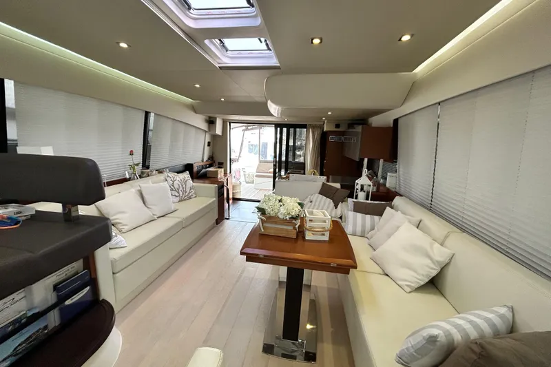  Yacht Photos Pics Luxurious interior of 2014 Prestige 550 Fly yacht with elegant seating and decor.