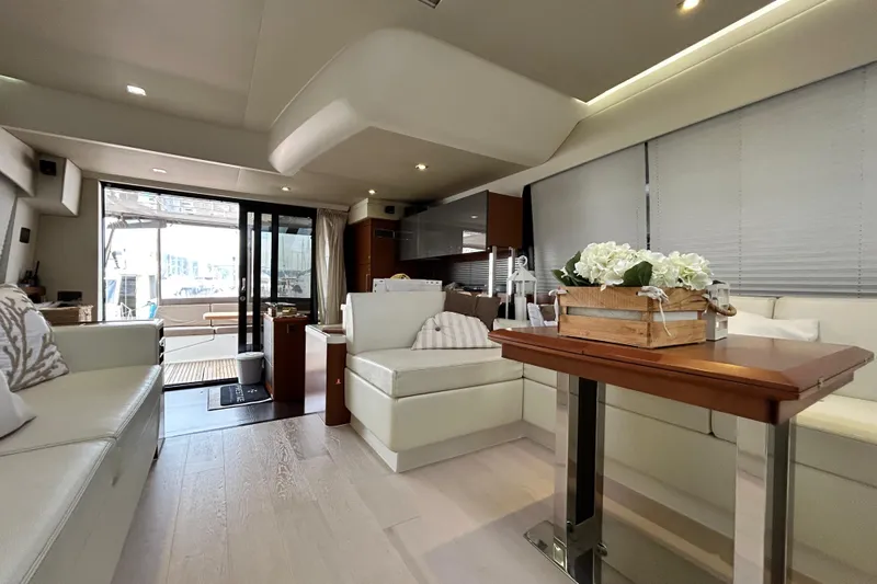  Yacht Photos Pics Luxurious interior of a 2014 Prestige 550 Fly yacht with elegant seating and decor.