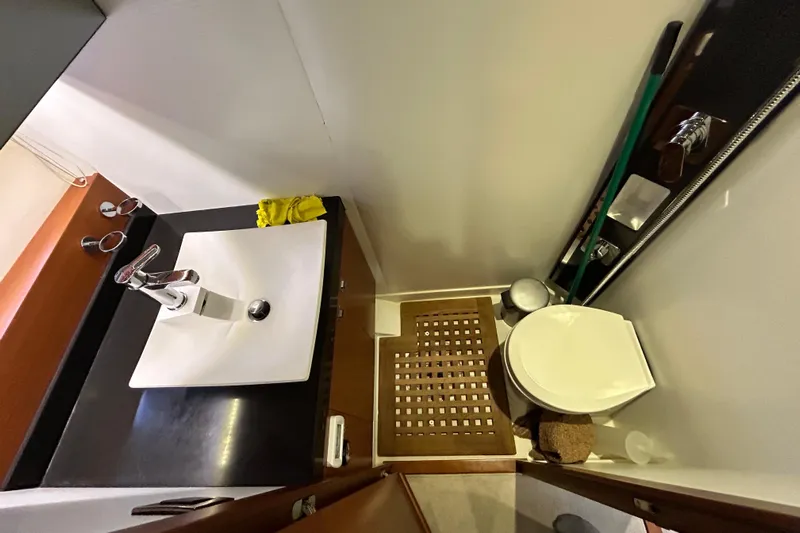  Yacht Photos Pics Bathroom interior of 2014 Prestige 550 Fly yacht, featuring sink and toilet.