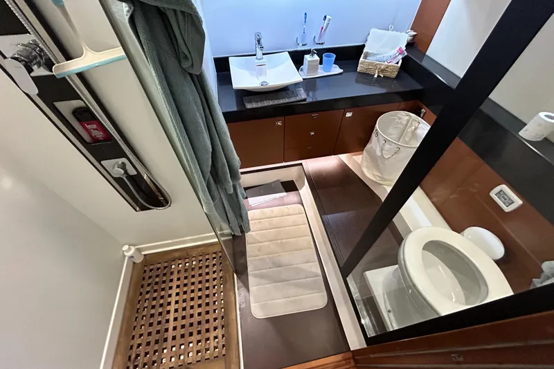  Yacht Photos Pics Luxurious bathroom interior of 2014 Prestige 550 Fly yacht, featuring modern fixtures and elegant design.