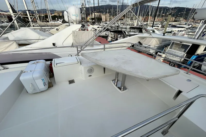  Yacht Photos Pics Prestige 550 Fly 2014 yacht deck with table and marina view.