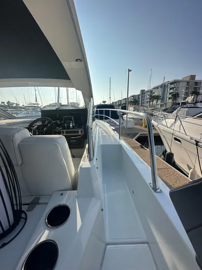 Lux Life Yacht Photos Pics 2017 Cruisers Yachts 390 Express Coupe docked at marina, side view.
