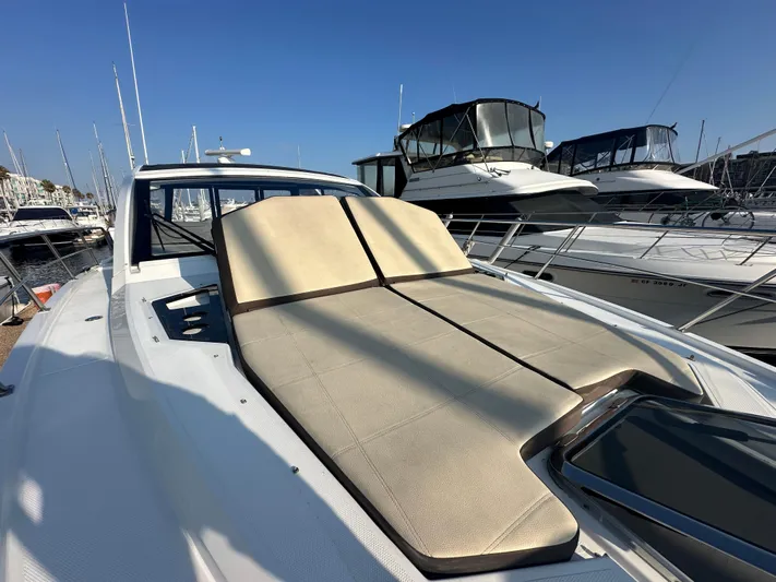 Lux Life Yacht Photos Pics 2017 Cruisers Yachts 390 Express Coupe with sunbathing deck, docked at marina.