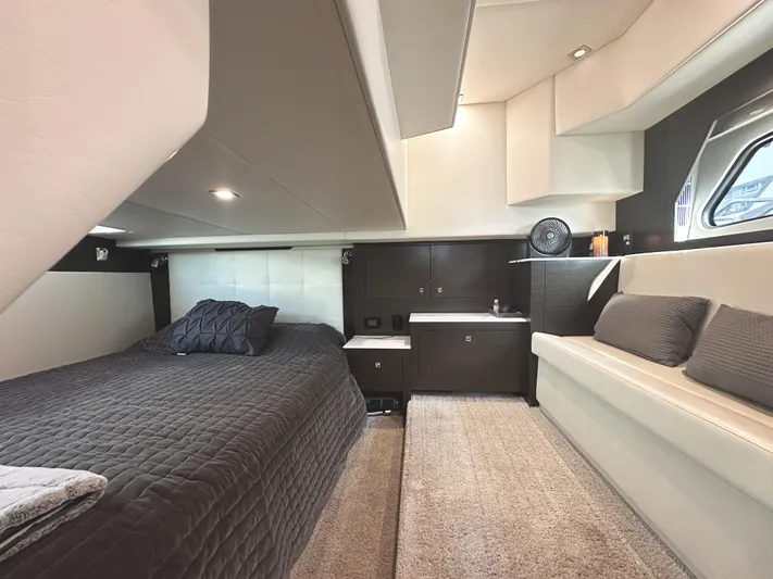 Lux Life Yacht Photos Pics Luxurious interior of 2017 Cruisers Yachts 390 Express Coupe with bed and seating area.