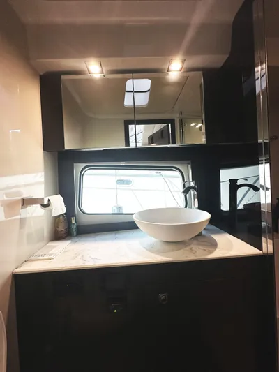 Lux Life Yacht Photos Pics Luxurious bathroom in 2017 Cruisers Yachts 390 Express Coupe with modern sink and mirror.