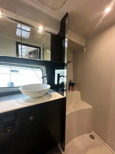 Lux Life Yacht Photos Pics Luxurious bathroom in 2017 Cruisers Yachts 390 Express Coupe with modern fixtures.