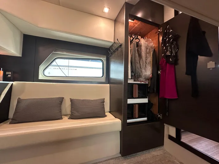 Lux Life Yacht Photos Pics Luxurious interior of 2017 Cruisers Yachts 390 Express Coupe with seating and wardrobe.