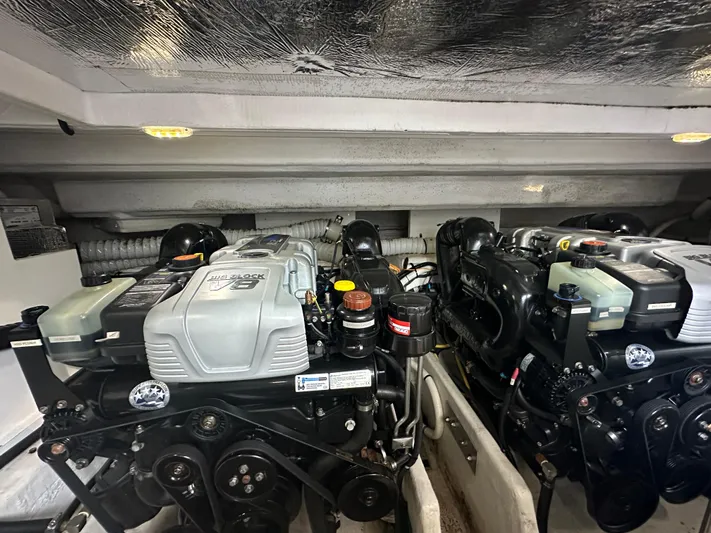 Lux Life Yacht Photos Pics Engine room of 2017 Cruisers Yachts 390 Express Coupe, showcasing dual engines.