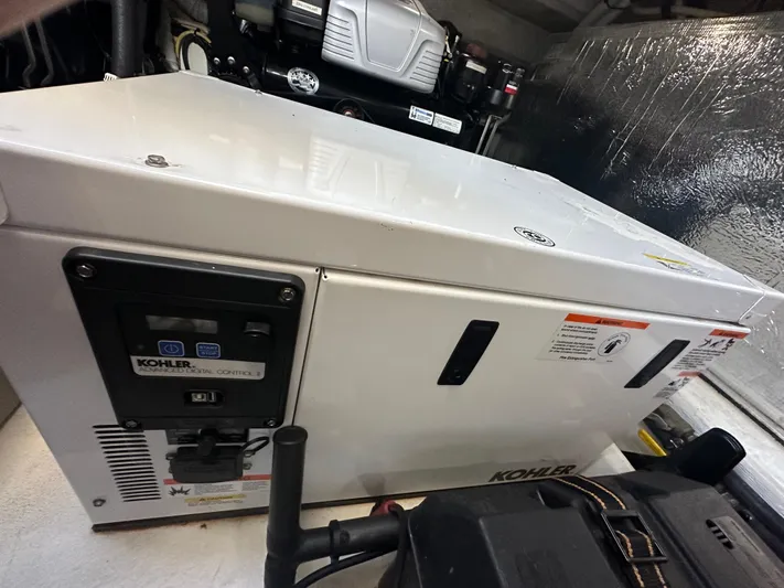 Lux Life Yacht Photos Pics Kohler generator in 2017 Cruisers Yachts 390 Express Coupe engine room.