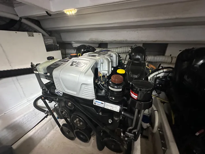 Lux Life Yacht Photos Pics Engine compartment of 2017 Cruisers Yachts 390 Express Coupe, showcasing mechanical components.