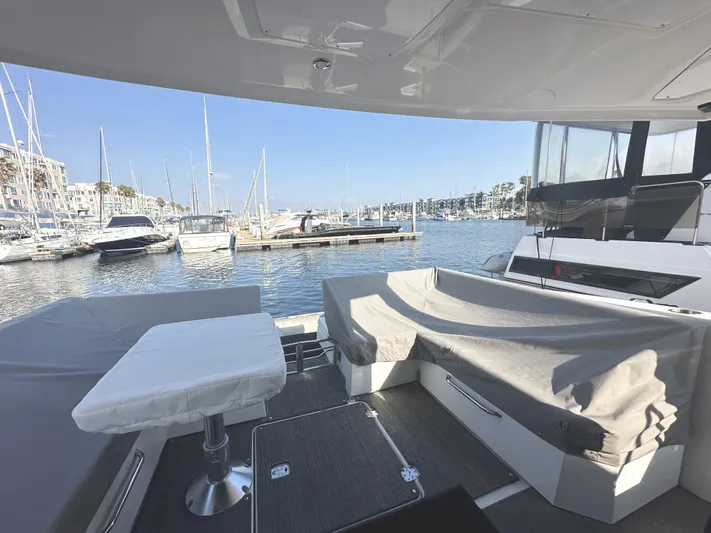 Lux Life Yacht Photos Pics 2017 Cruisers Yachts 390 Express Coupe, marina view, spacious deck seating, modern design.
