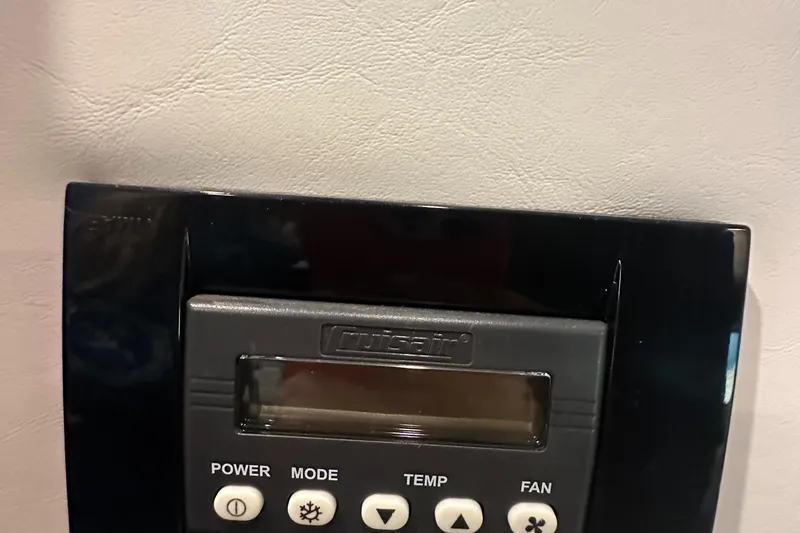 Lux Life Yacht Photos Pics Control panel on 2017 Cruisers Yachts 390 Express Coupe, featuring power, mode, temp, and fan buttons.