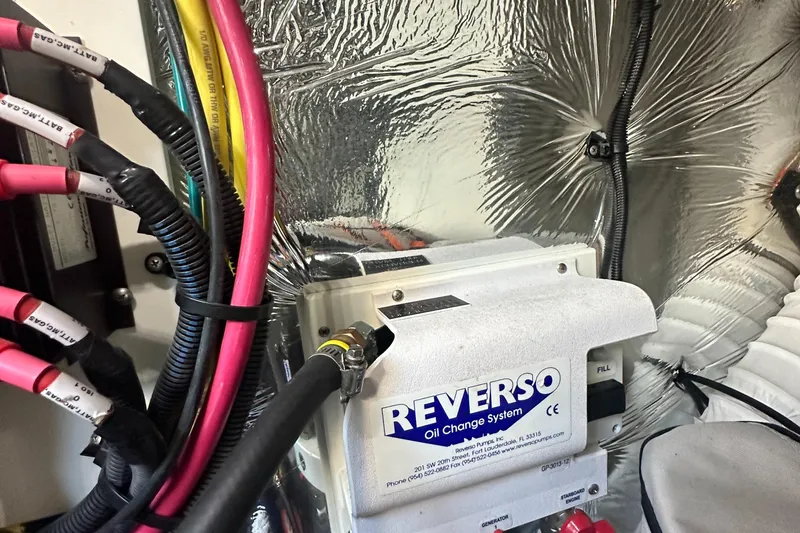 Lux Life Yacht Photos Pics Reverso oil change system in 2017 Cruisers Yachts 390 Express Coupe engine room.