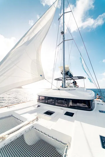  Yacht Photos Pics Sailing on a 2019 Lagoon 52 F catamaran under clear skies.