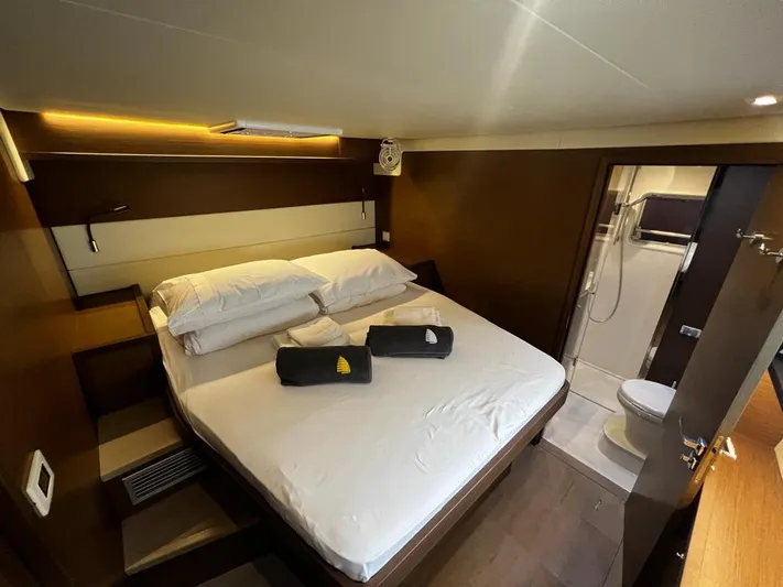  Yacht Photos Pics Luxurious cabin interior of 2019 Lagoon 52 F yacht with ensuite bathroom.